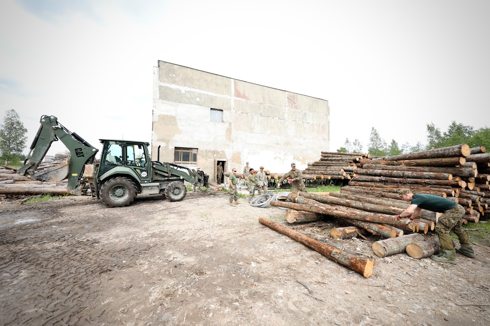 Marines and Latvian Engineers Cut Lumber for Trench Support - BALTOPS 25
