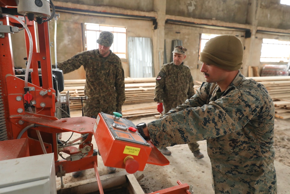 Marines and Latvian Engineers Cut Lumber for Trench Support - BALTOPS 25