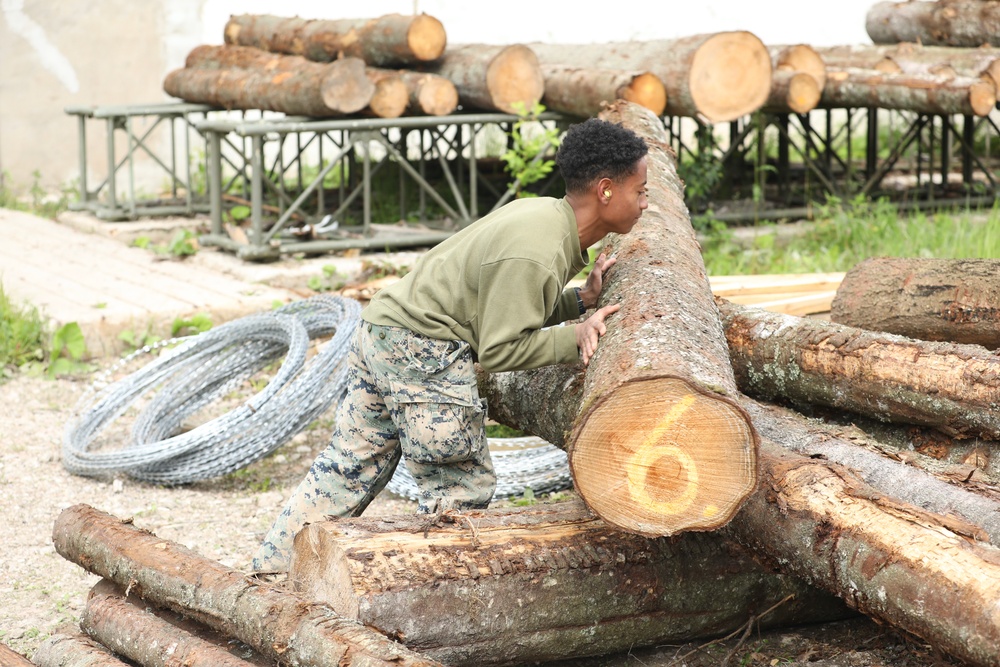 Marines and Latvian Engineers Cut Lumber for Trench Support - BALTOPS 25