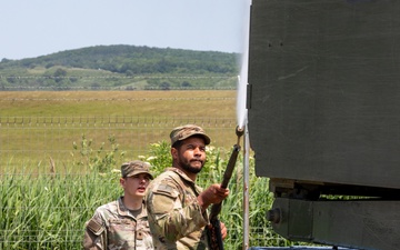 41st FAB washes down MLRS before transportation procedures during Saber Guardian 25