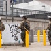 Soldiers of the 1st Battalion, 185th Infantry Regiment provide protection to a federal building