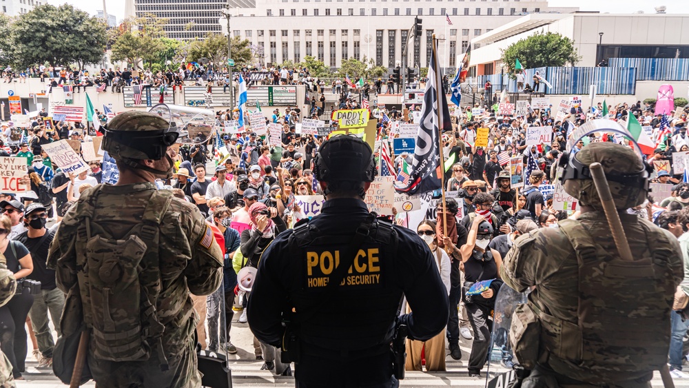 U.S. Army Soldiers and U.S. Marines provide protection to a federal building