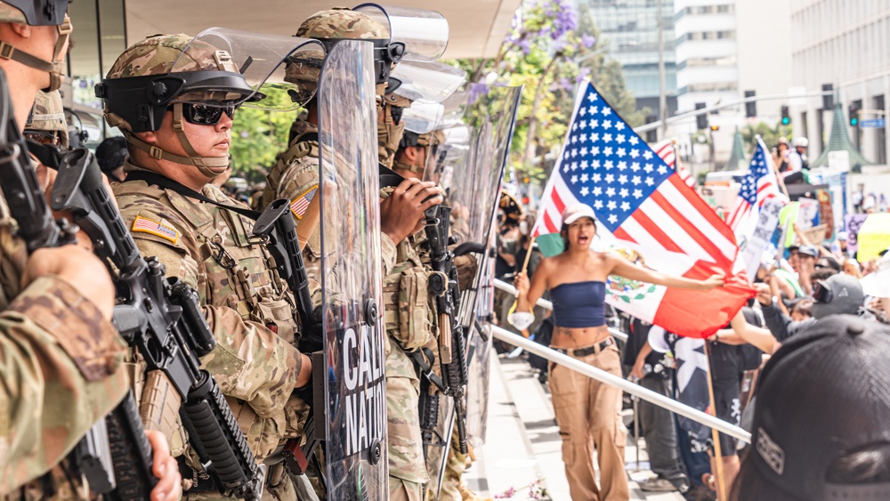 U.S. Army Soldiers and U.S. Marines provide protection to a federal building