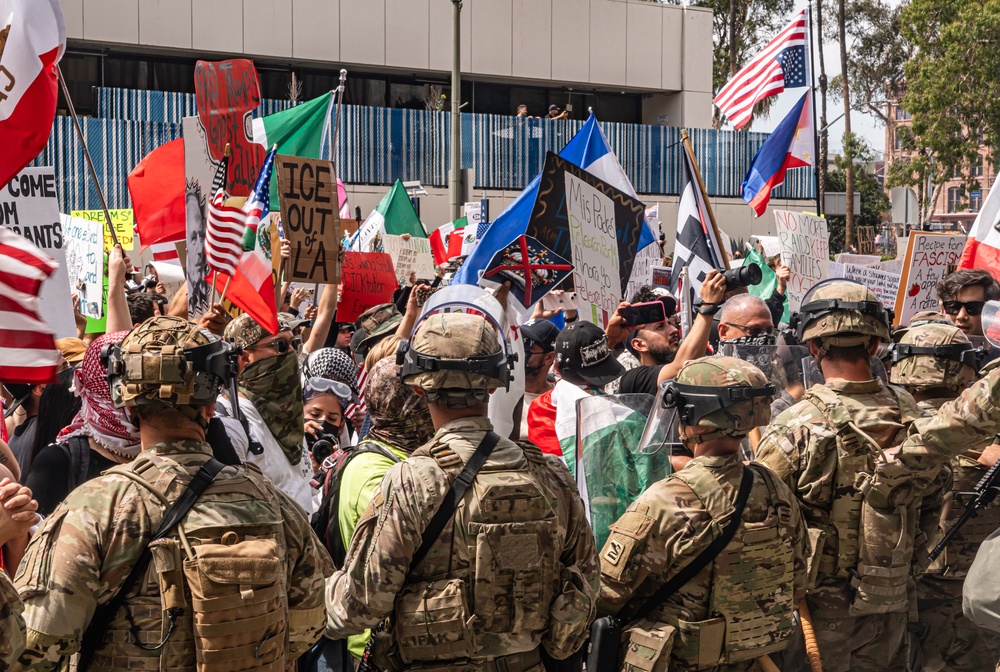 U.S. Army Soldiers and U.S. Marines provide protection to a federal building