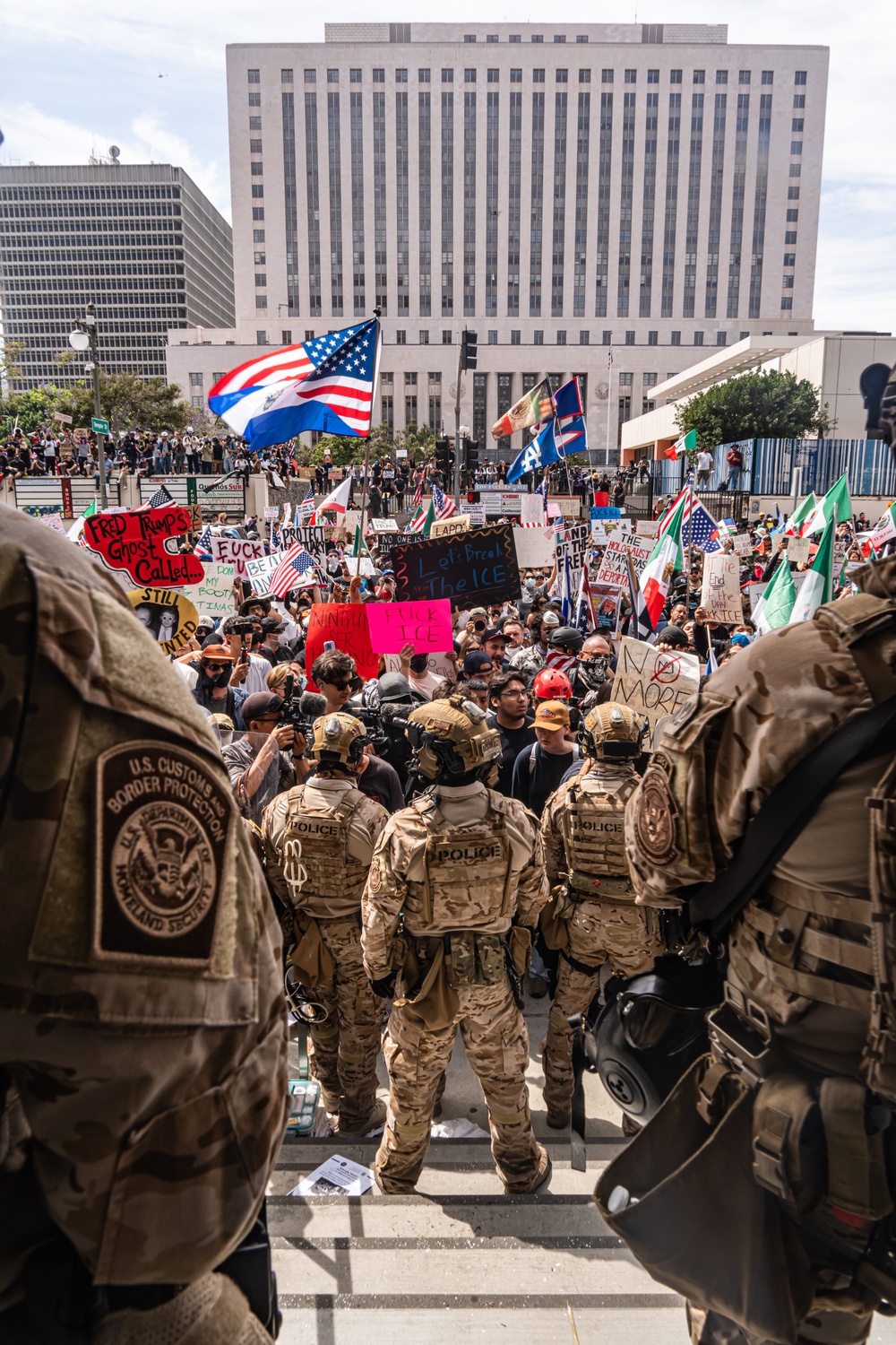 U.S. Army Soldiers and U.S. Marines provide protection to a federal building