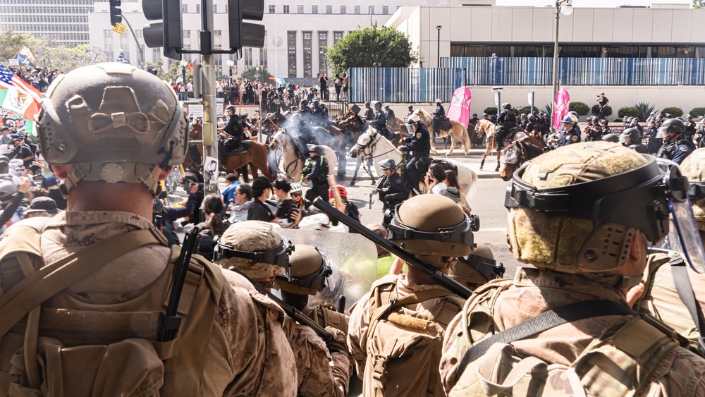 U.S. Soldiers and U.S. Marines provide protection to federal building