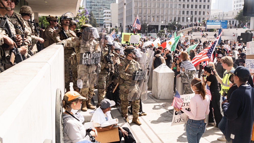 U.S. Soldiers and U.S. Marines provide protection to federal building