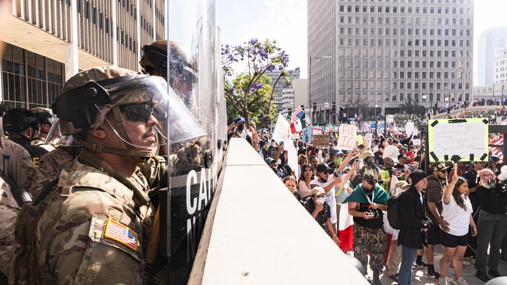 U.S. Soldiers and U.S. Marines provide protection to federal building