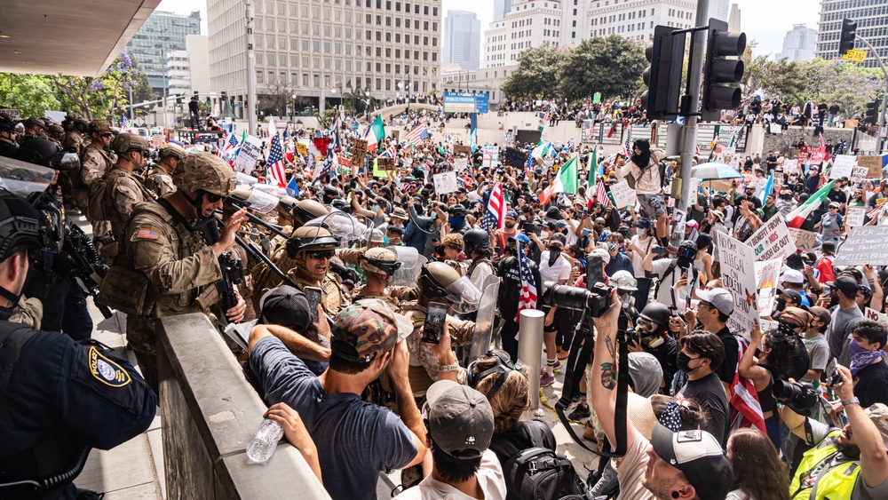 U.S. Soldiers and U.S. Marines provide protection to federal building