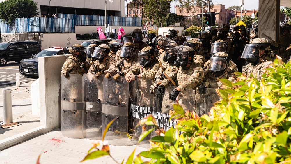 U.S. Soldiers and U.S. Marines provide protection to federal building