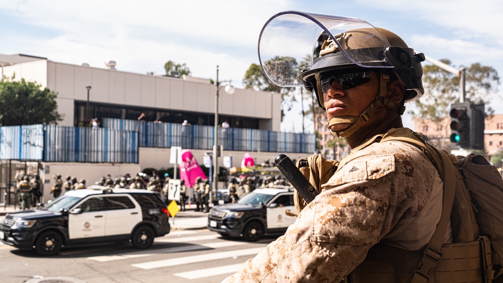 U.S. Soldiers and U.S. Marines provide protection to federal building