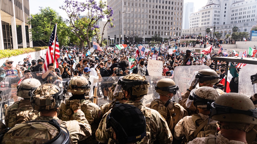 U.S. Soldiers and U.S. Marines provide protection to federal building