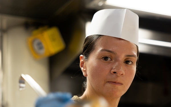 Curtis Wilbur Sailor Prepares Dinner