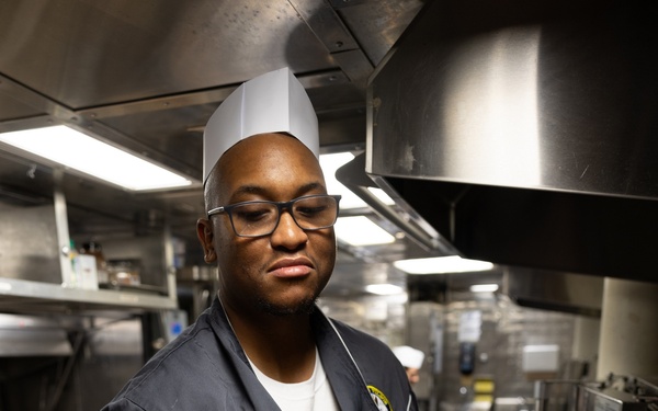 Curtis Wilbur Sailor Prepares Dinner