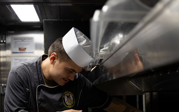 Curtis Wilbur Sailor Prepares For Dinner Service