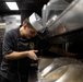 Curtis Wilbur Sailor Prepares For Dinner Service