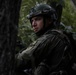 Kosovo Security Force soldier applies face paint during training at JRTC