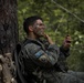 Kosovo Security Force soldier applies face paint during training at JRTC