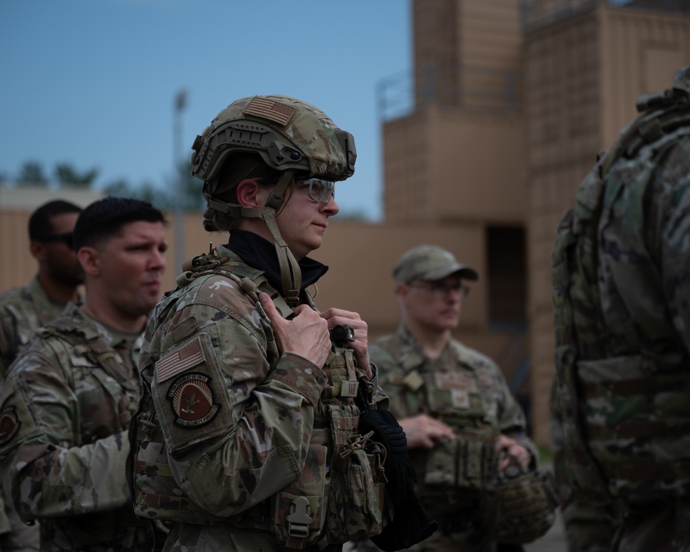 932nd airmen prepare for simulated breaching and entering movements.