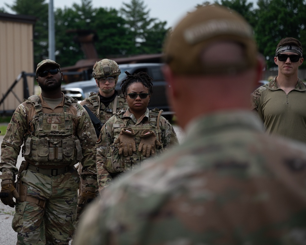 932nd airmen prepare for simulated breaching and entering movements.