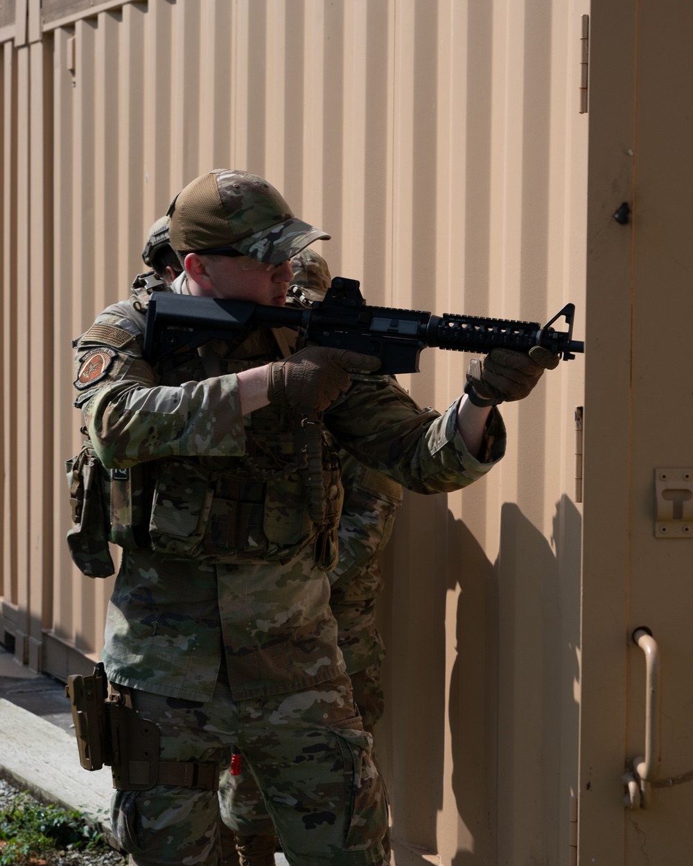 932nd airmen prepare for simulated breaching and entering movements.