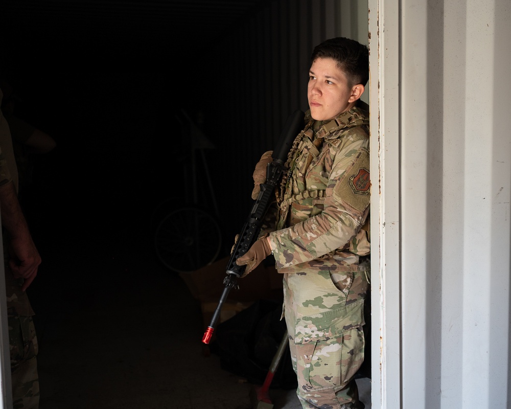 932nd airmen prepare for simulated breaching and entering movements.