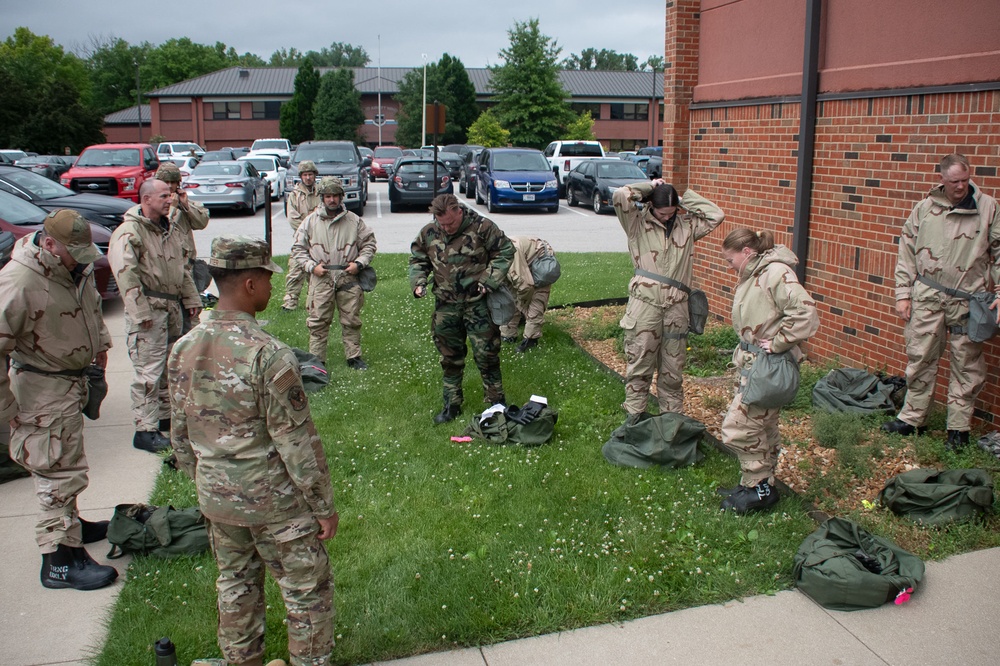 932nd airmen practice donning and taking off MOPP gear