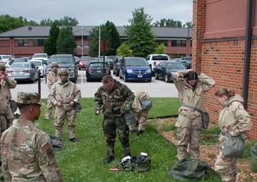 932nd airmen practice donning and taking off MOPP gear