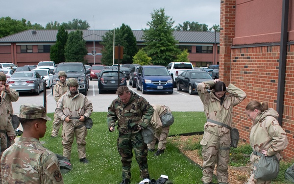 932nd airmen practice donning and taking off MOPP gear