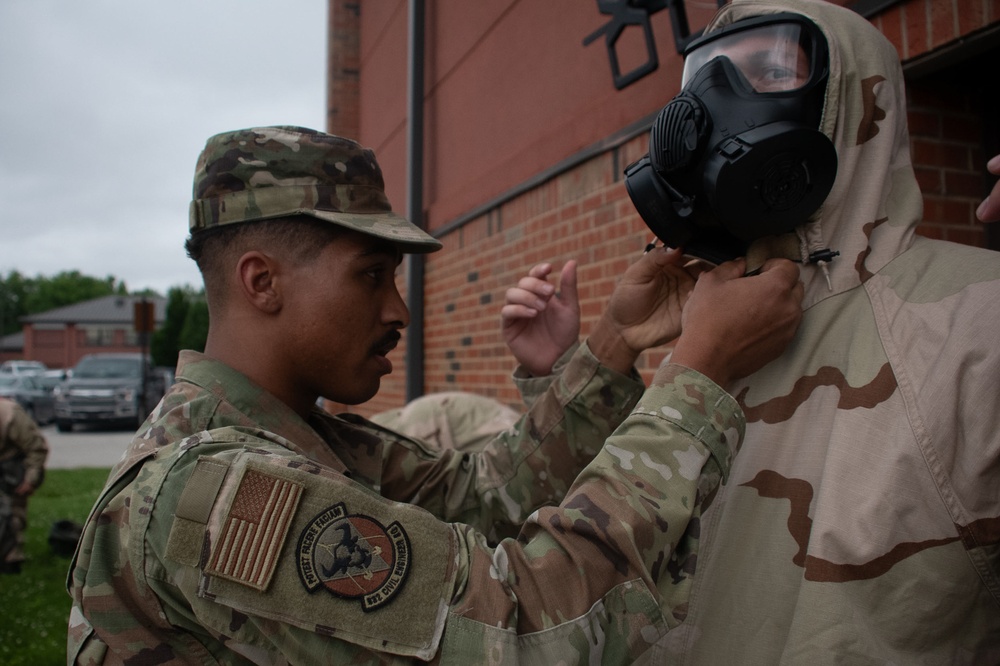 932nd airmen practice donning and taking off MOPP gear