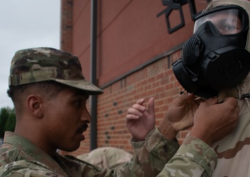932nd airmen practice donning and taking off MOPP gear
