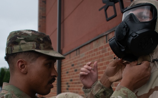932nd airmen practice donning and taking off MOPP gear