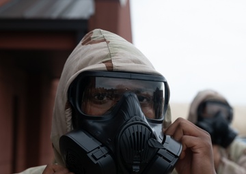 932nd airmen practice donning and taking off MOPP gear