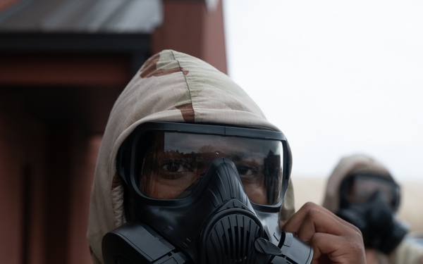 932nd airmen practice donning and taking off MOPP gear