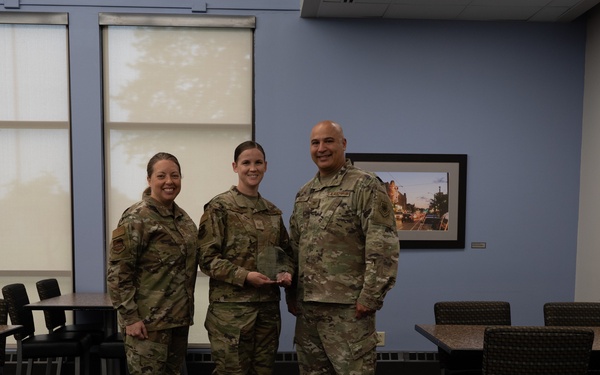 Quarterly Awards winners accept their award.