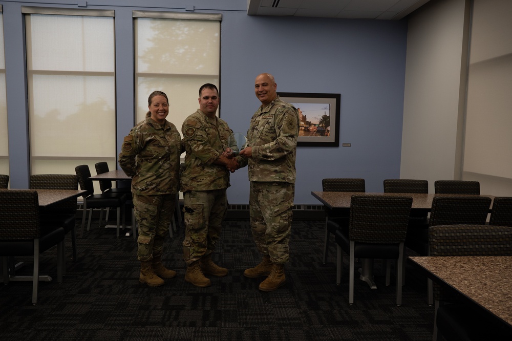 Quarterly Awards winners accept their award.