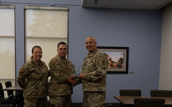 Quarterly Awards winners accept their award.