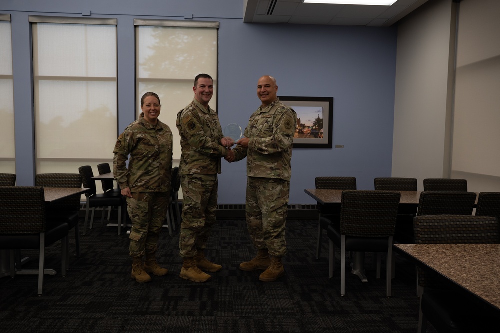 Quarterly Awards winners accept their award.