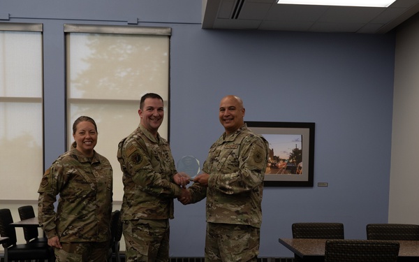 Quarterly Awards winners accept their award.