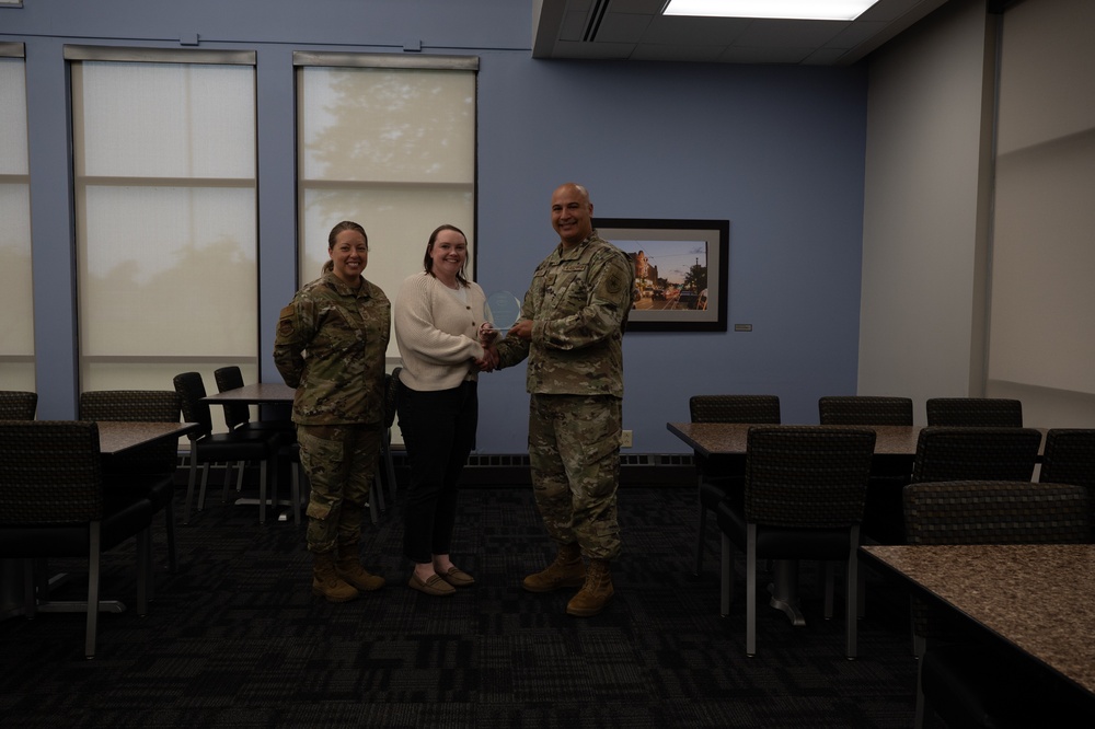 Quarterly Awards winners accept their award.