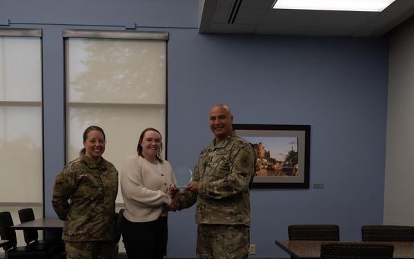 Quarterly Awards winners accept their award.