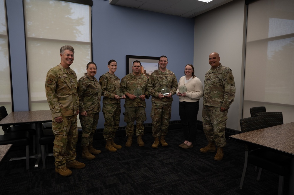 Quarterly Awards winners accept their award.