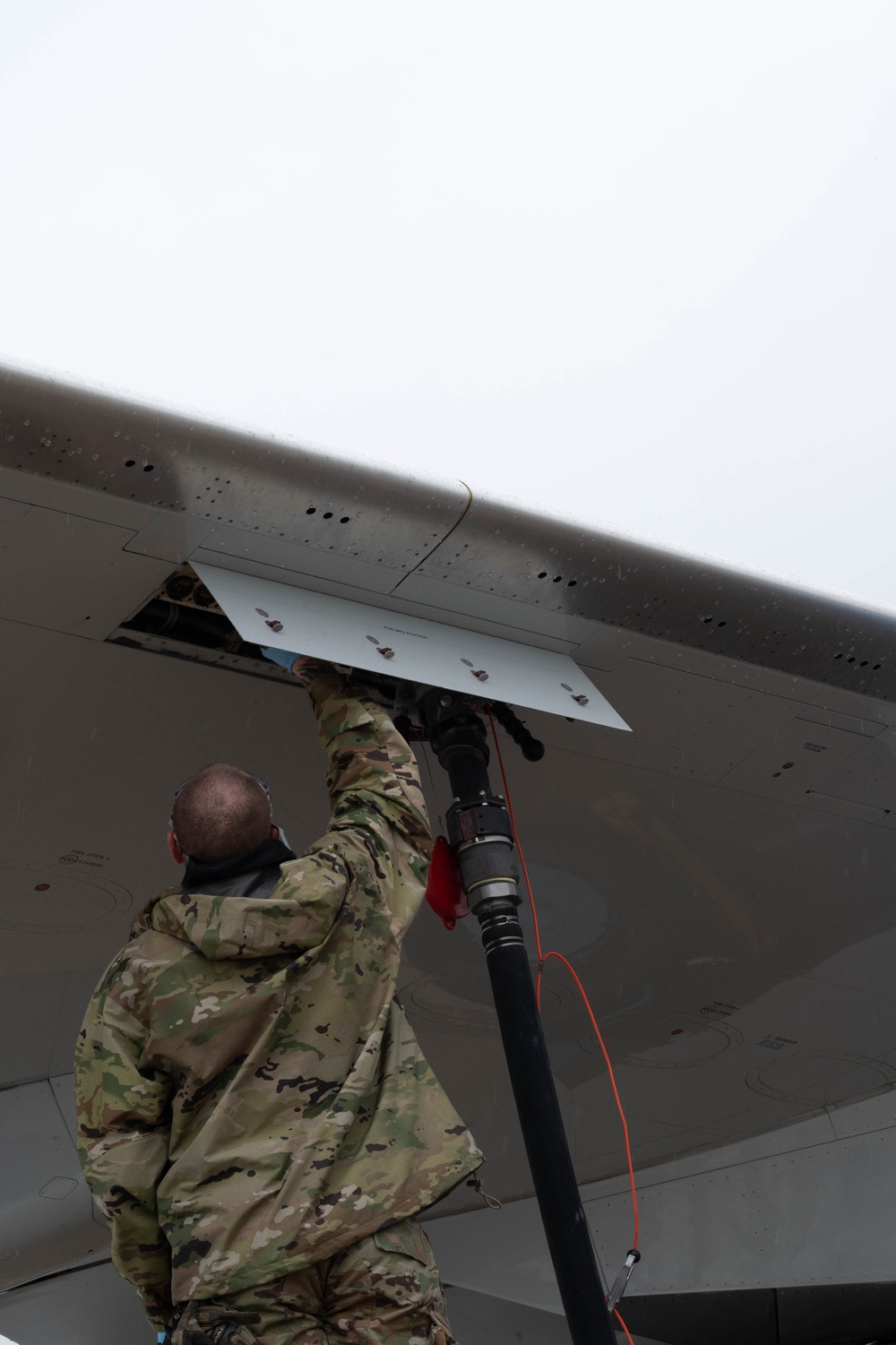 QLLEX participant assists in refueling a C-40