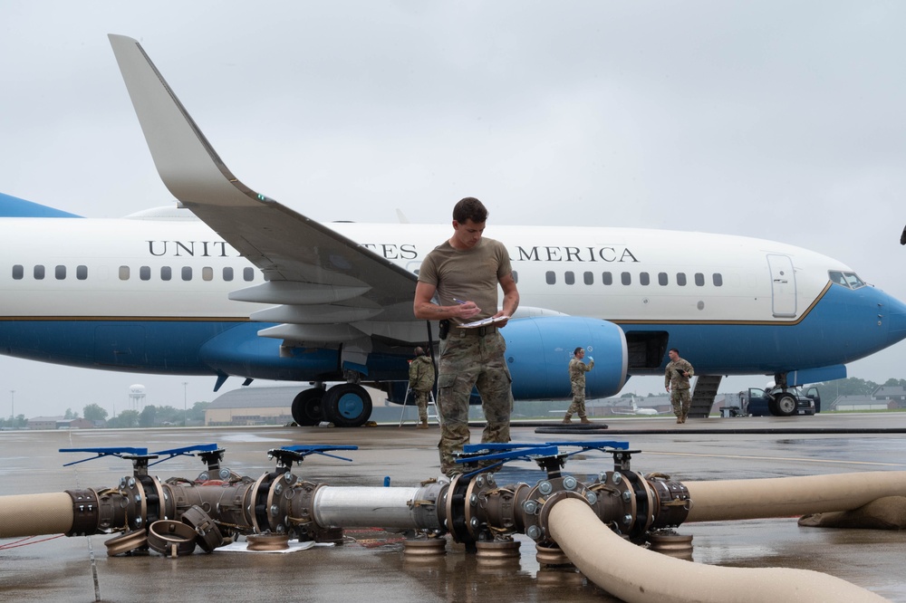 QLLEX participant assists in refueling a C-40