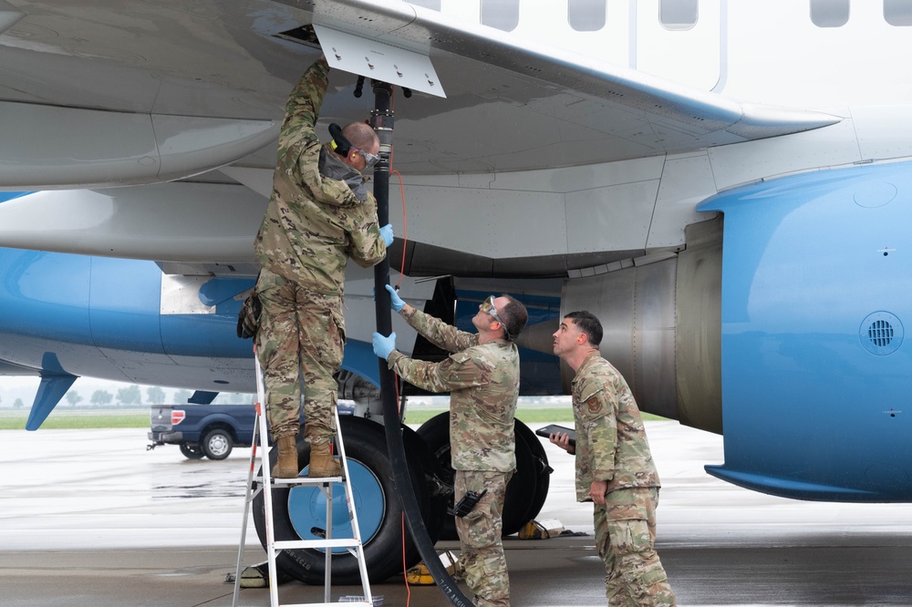 QLLEX participants assists in refueling a C-40