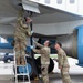 QLLEX participants assists in refueling a C-40