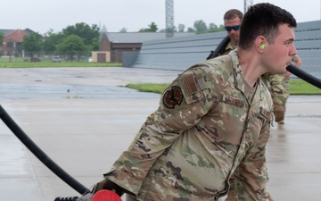 QLLEX participants assists in refueling a C-40