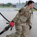 QLLEX participants assists in refueling a C-40