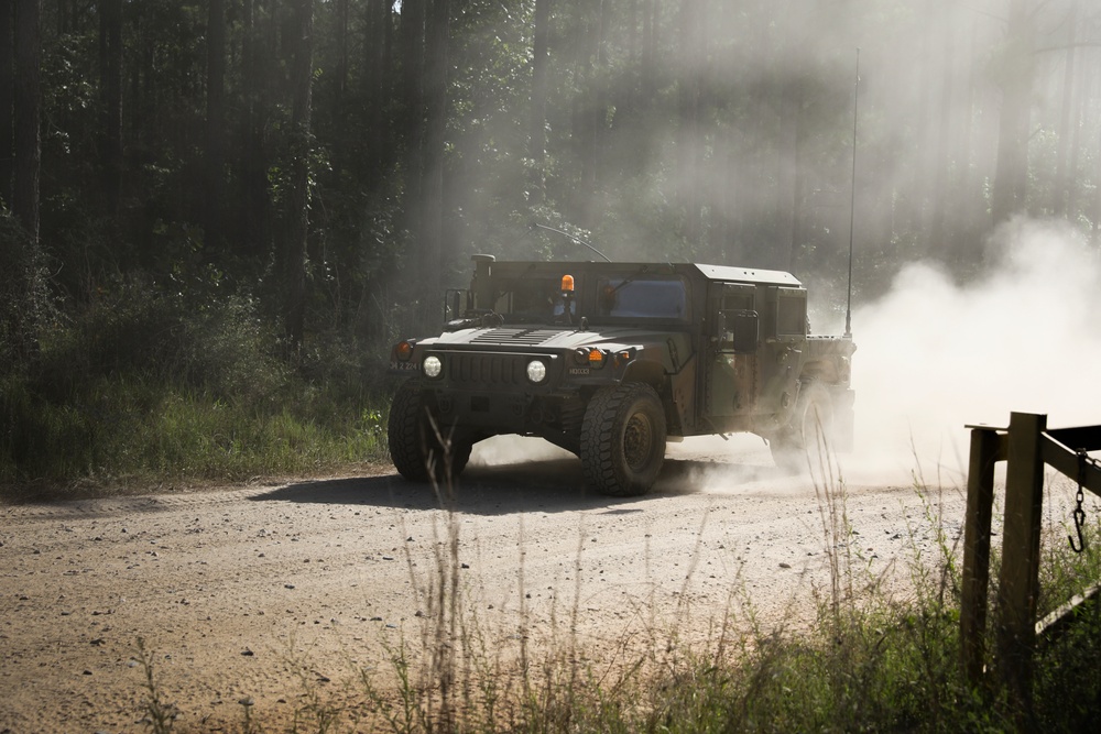 Iowa National Guard Humvee maneuvers through dust at JRTC
