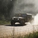 Iowa National Guard Humvee maneuvers through dust at JRTC